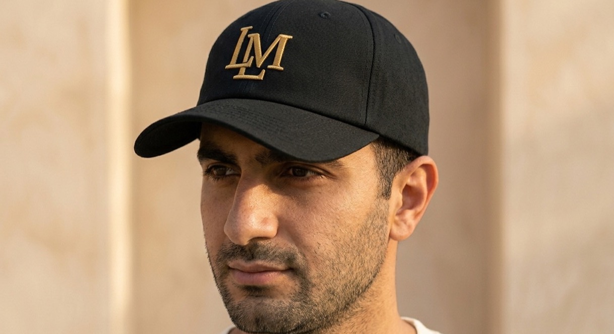 The Crest Cap — “LM”, worn. Ink & Gold.