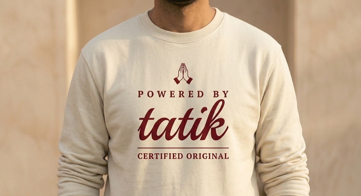 The Tatik Sweatshirt — “Powered by tatik.”, worn. Oatmeal.