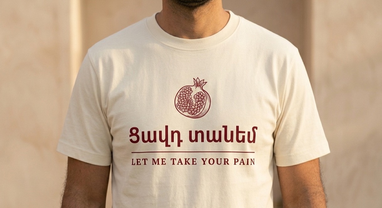 The Tsavt Tanem Tee — “Let me take your pain.”, worn. Warm Cream.